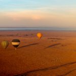 high angle shot of three air balloons at sunrise i 2022 12 31 05 02 50 utc